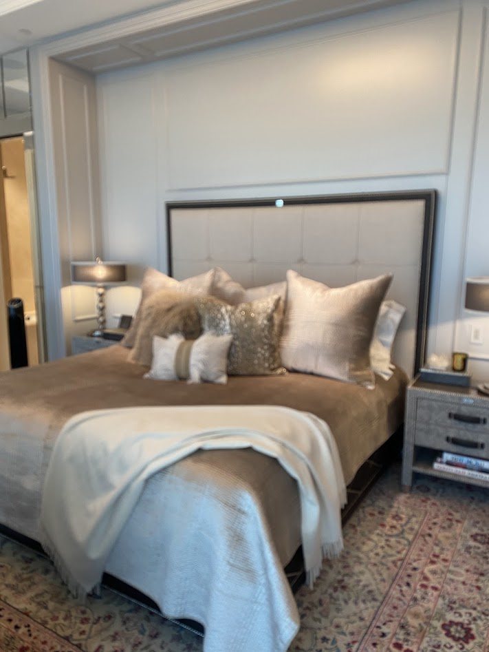 Big Bear master bedroom with upholstered headboard and antique rug